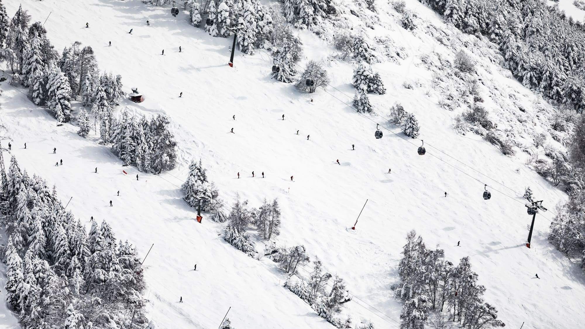 a group of people skiing on a snowy mountain