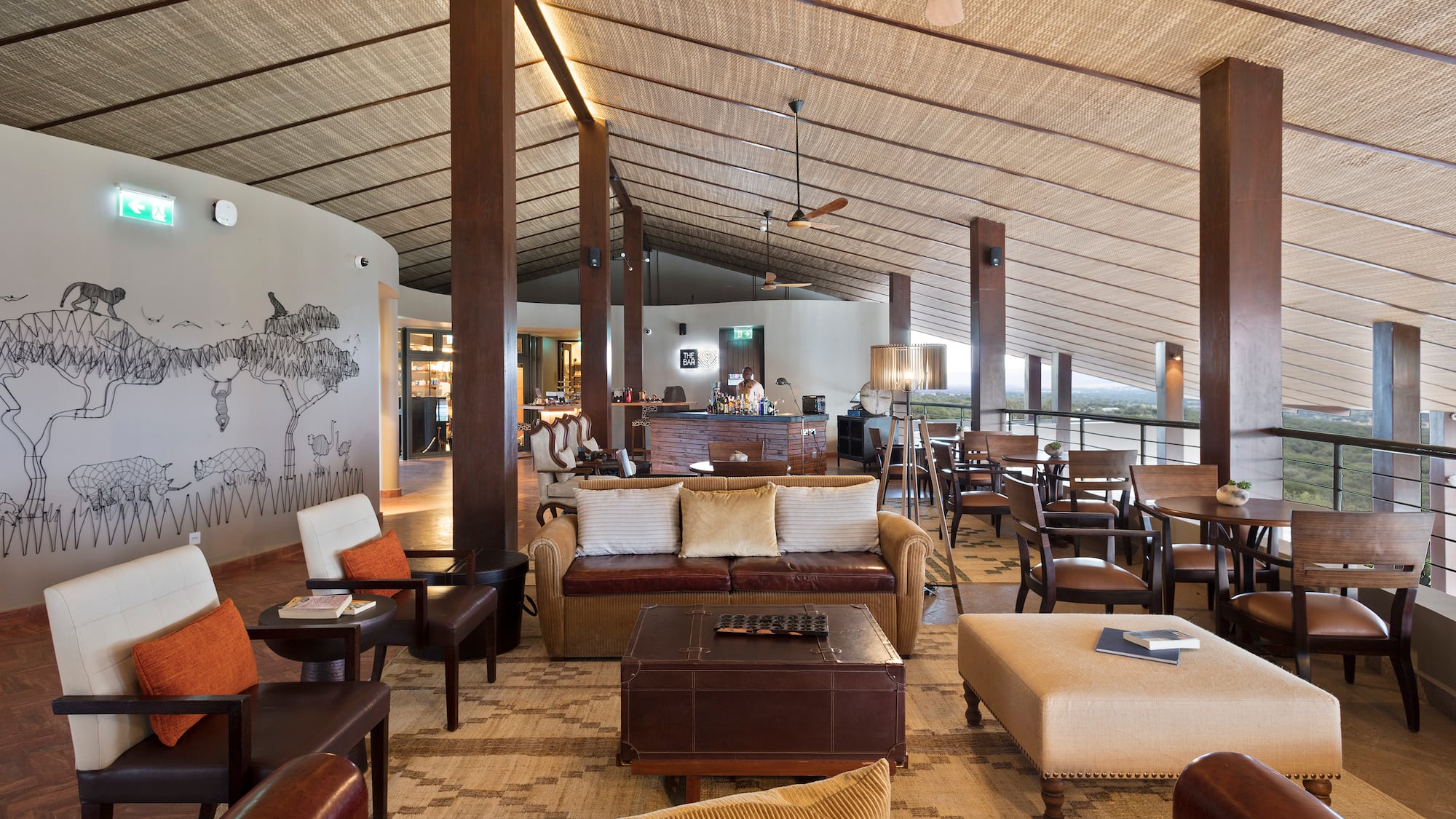 a room with a large ceiling and a large table and chairs