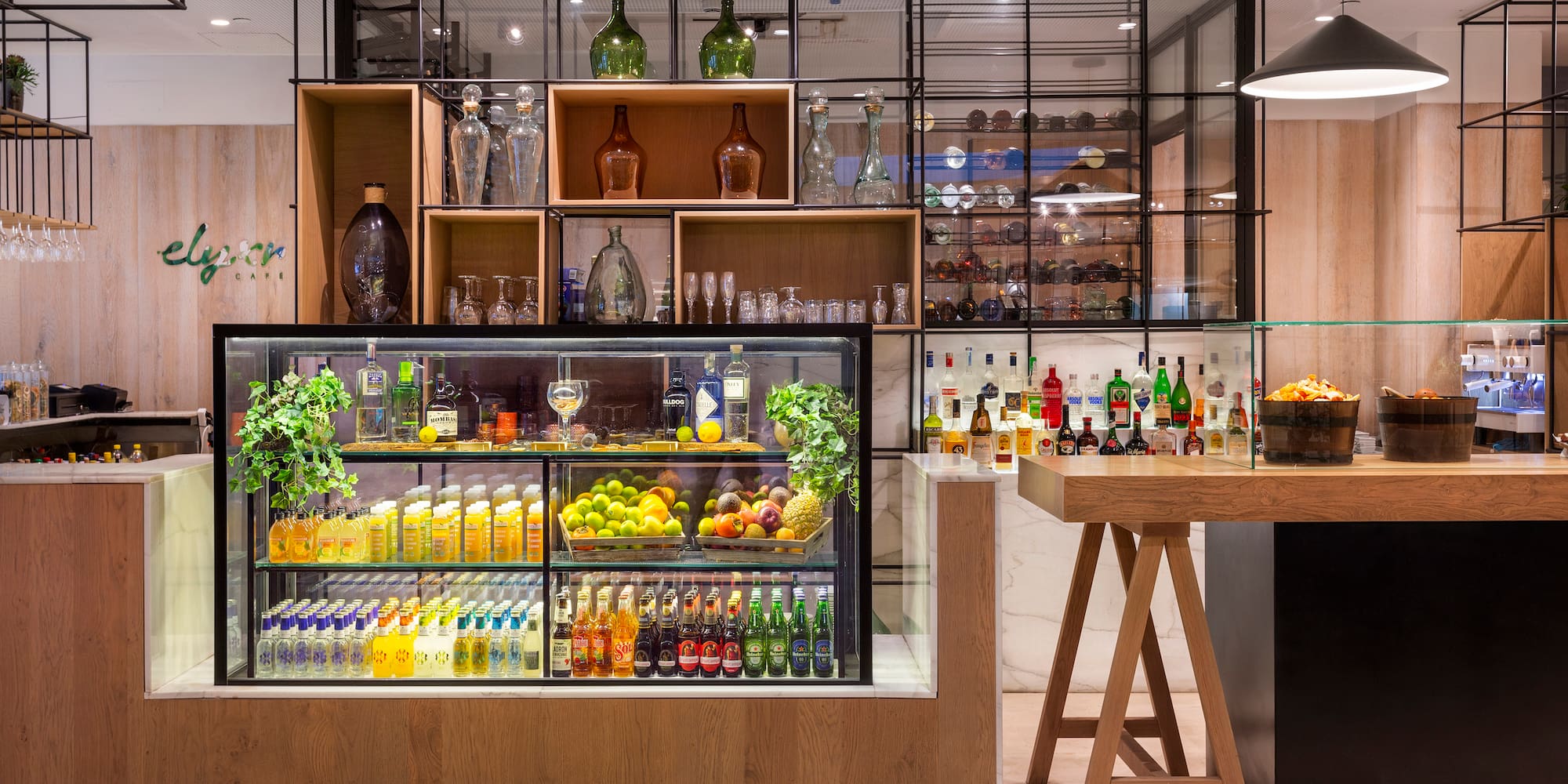 a bar with shelves of drinks and bottles