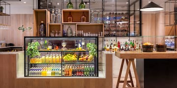 a bar with shelves of drinks and bottles