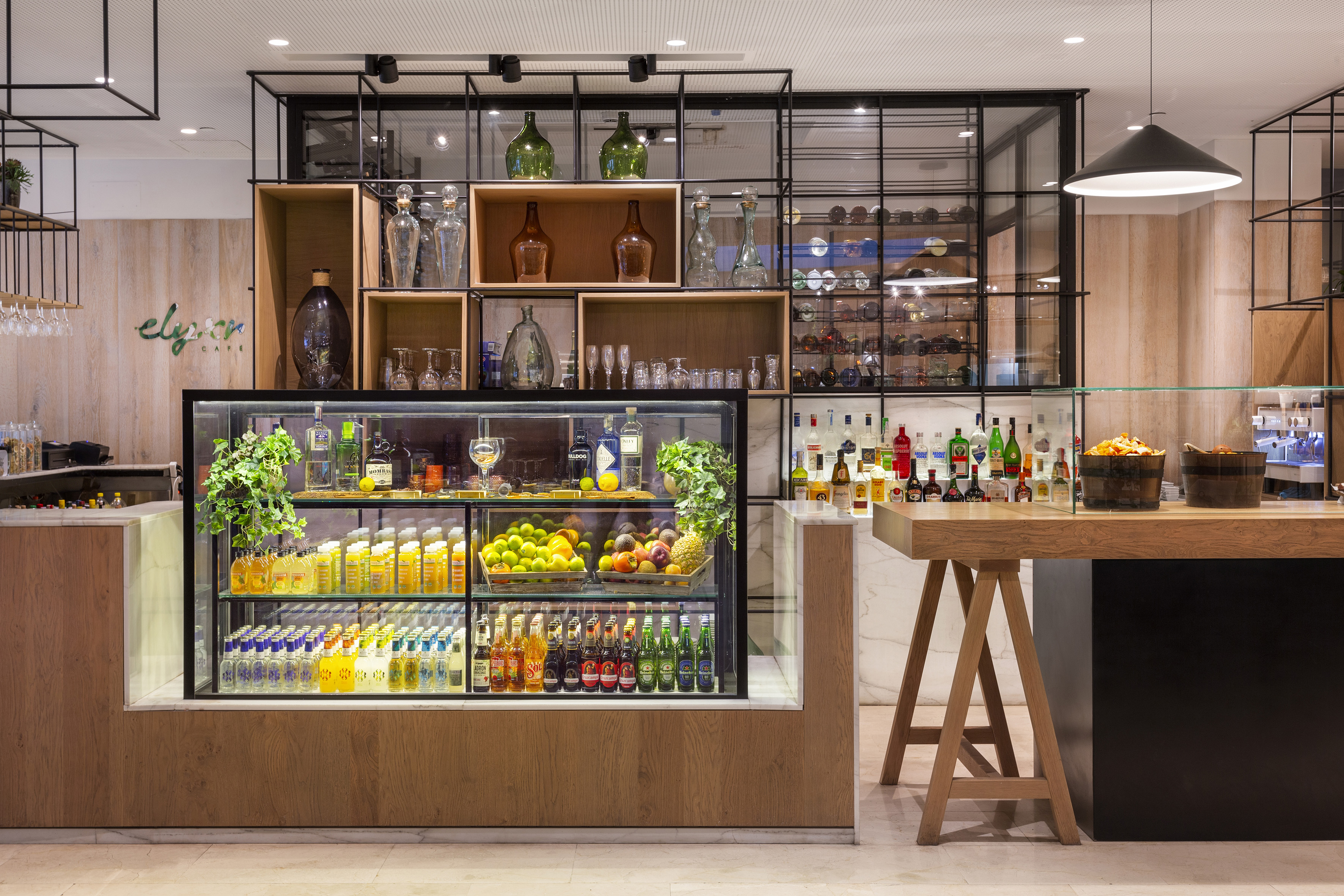 a bar with shelves of drinks and bottles