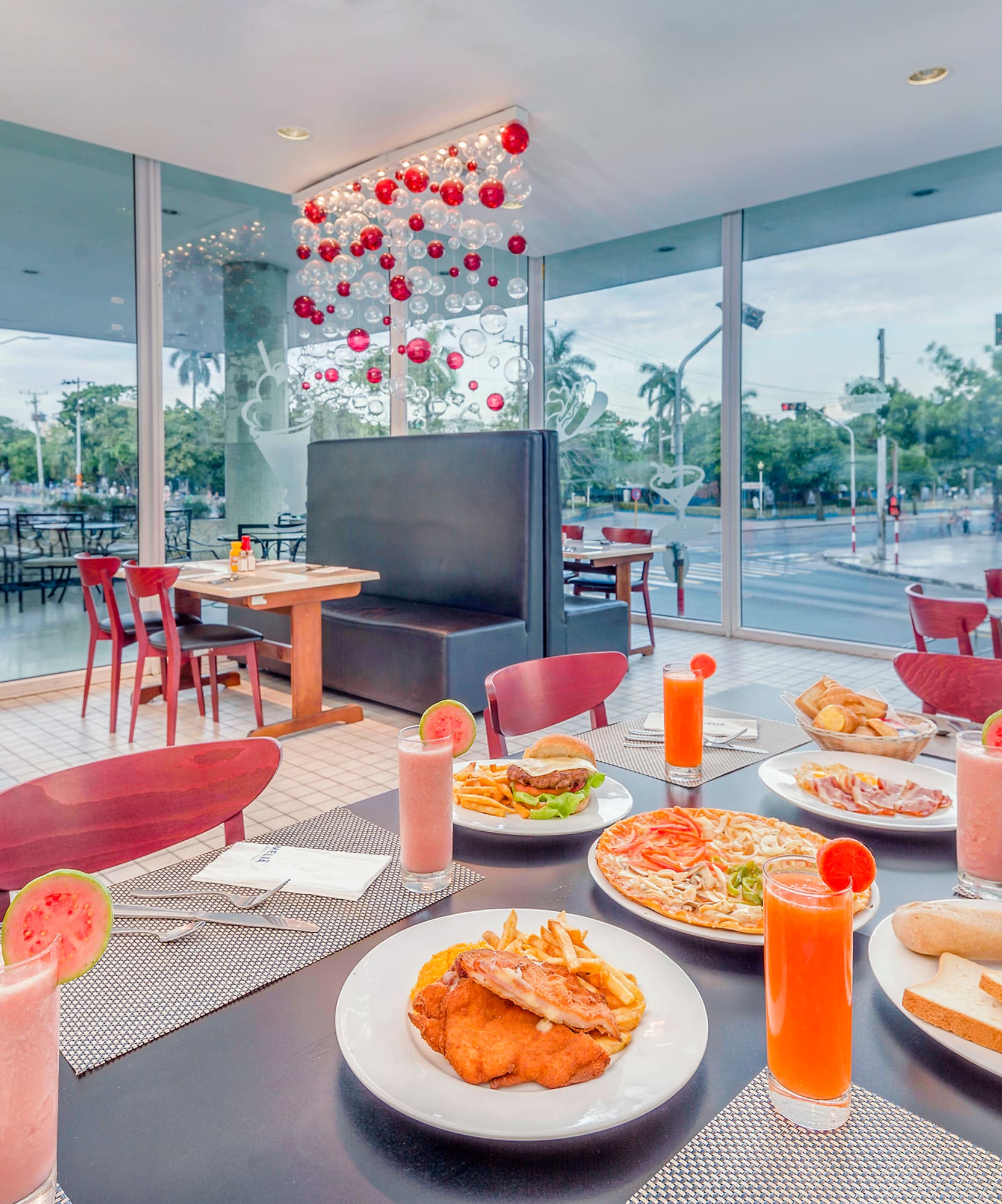 a table with plates of food and drinks