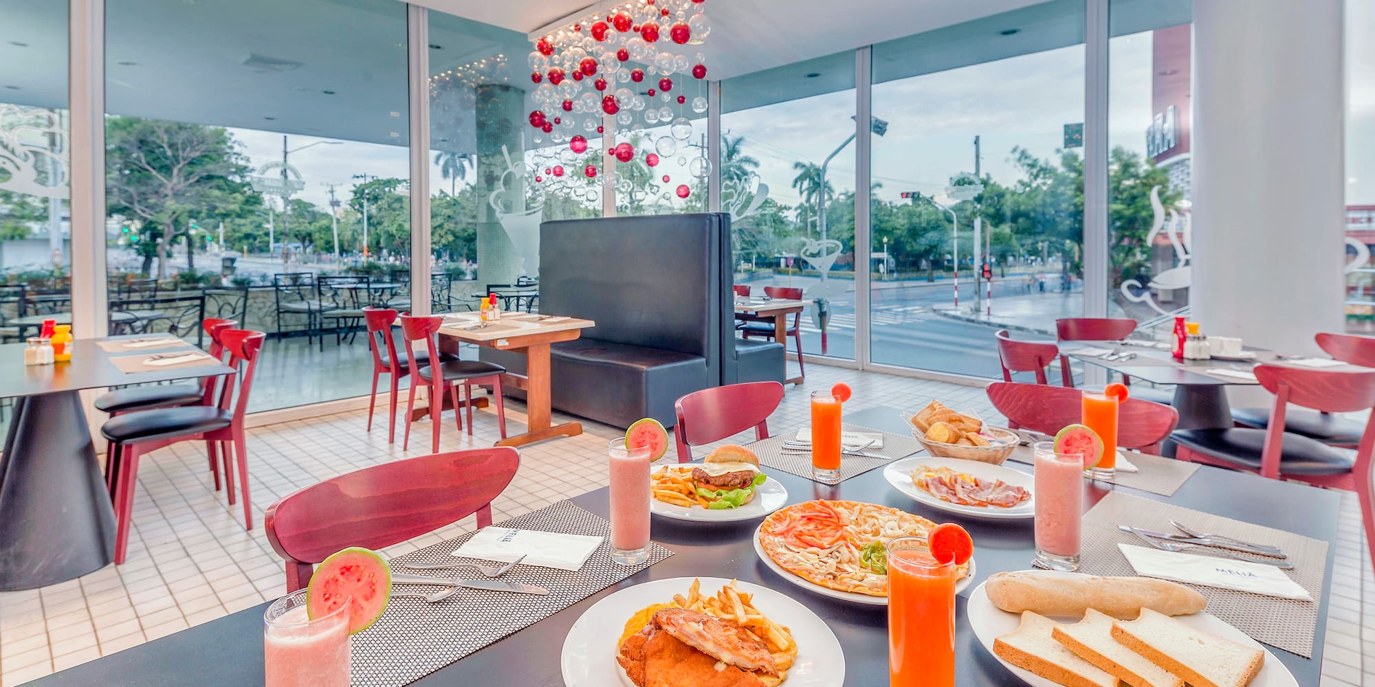 a table with plates of food and drinks