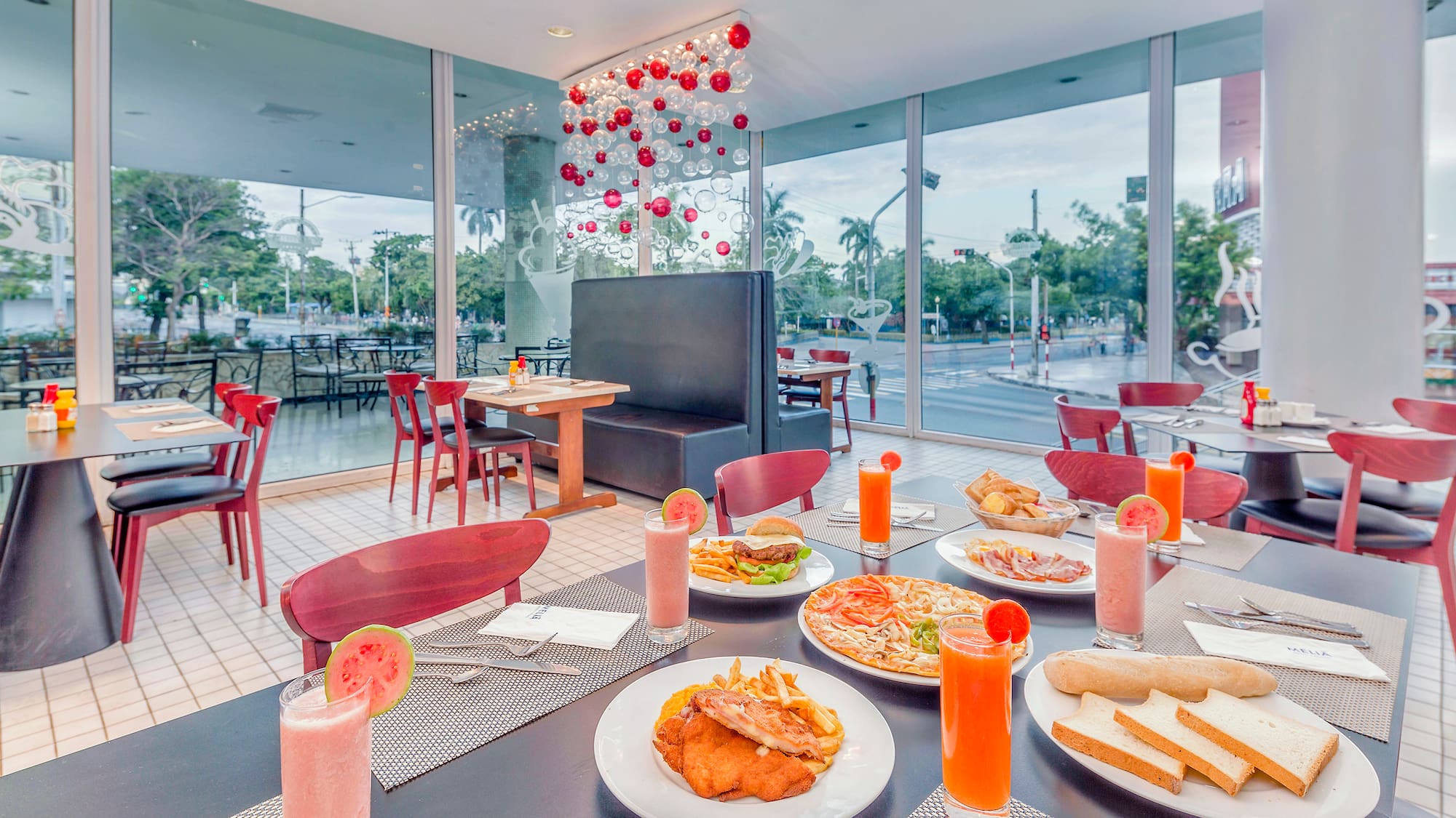 a table with plates of food and drinks