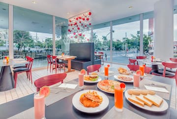 a table with plates of food and drinks