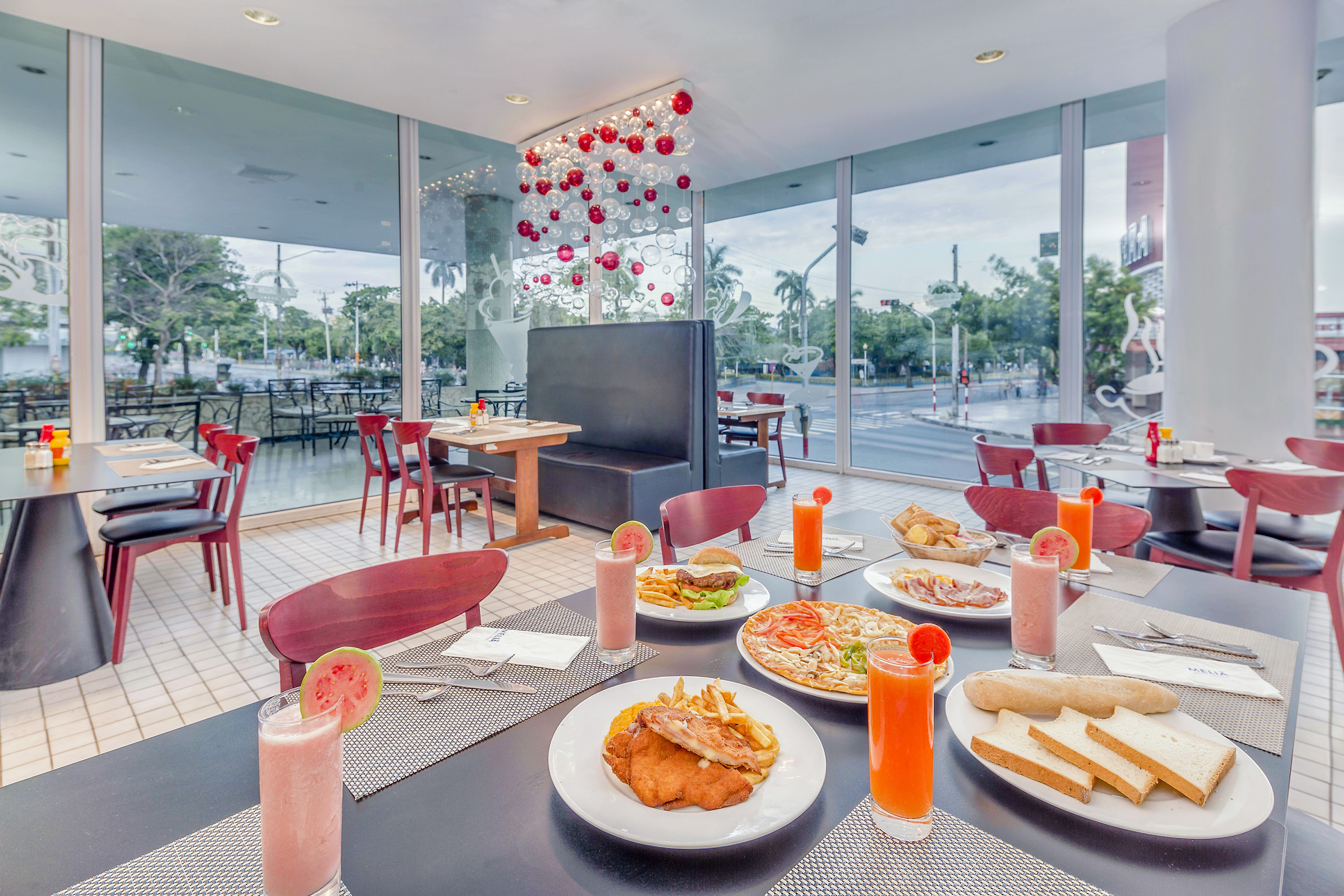 a table with plates of food and drinks