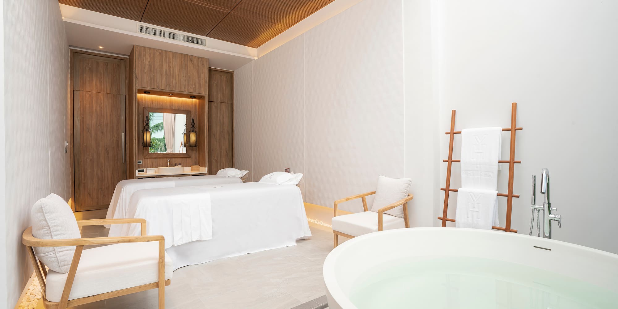 a room with a tub and a bed