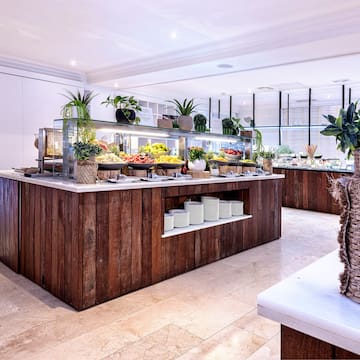 a buffet with plants on the counter