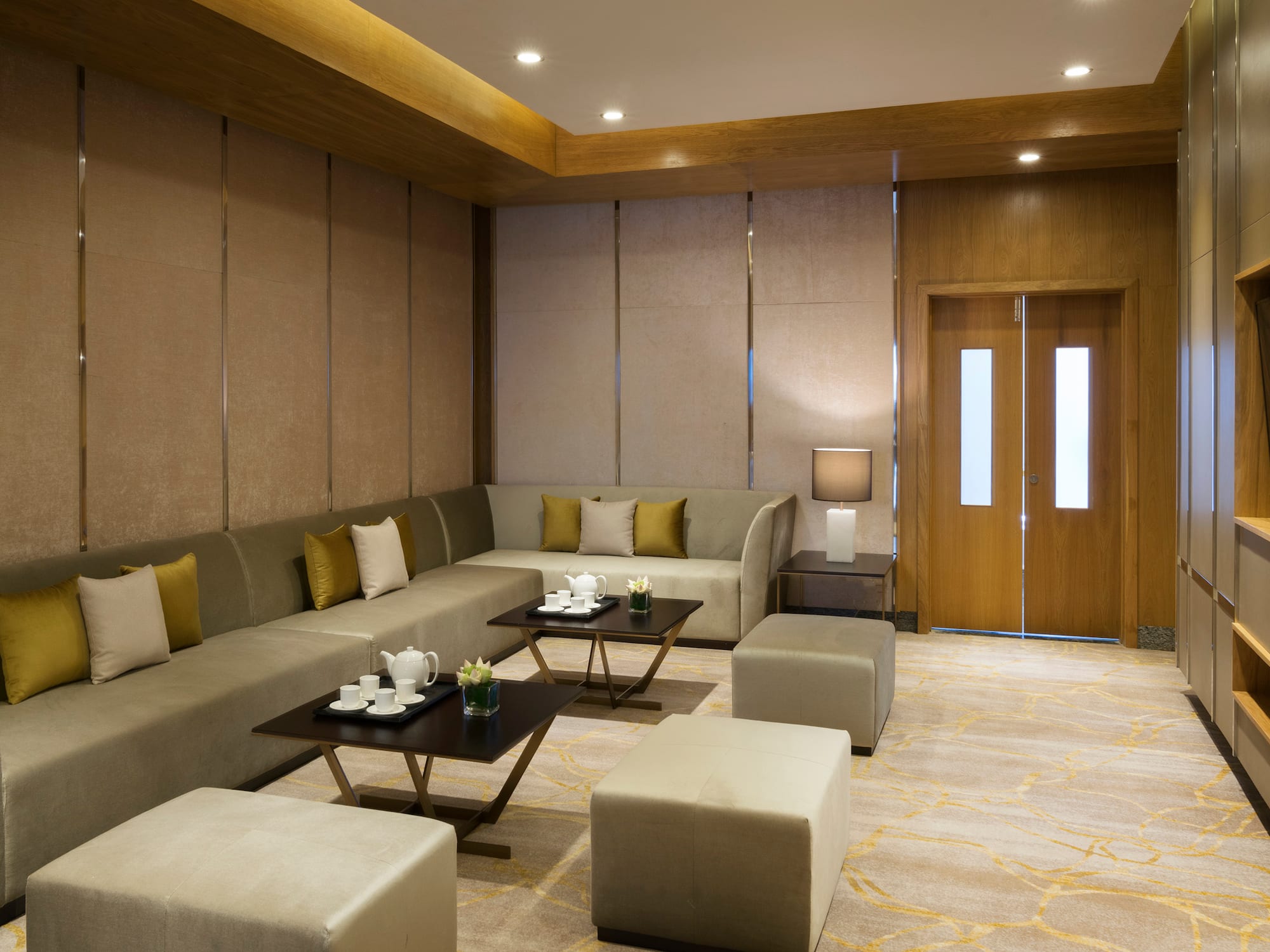 a room with a couch and coffee tables