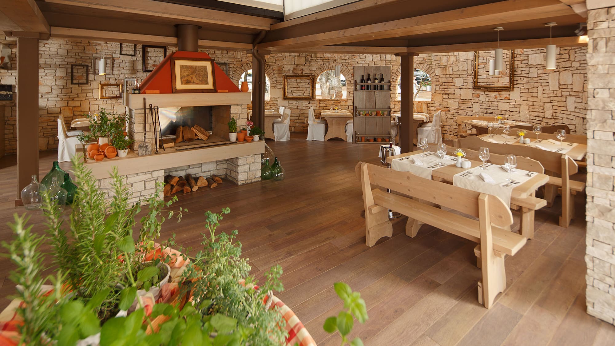 a room with a table and chairs and a fireplace
