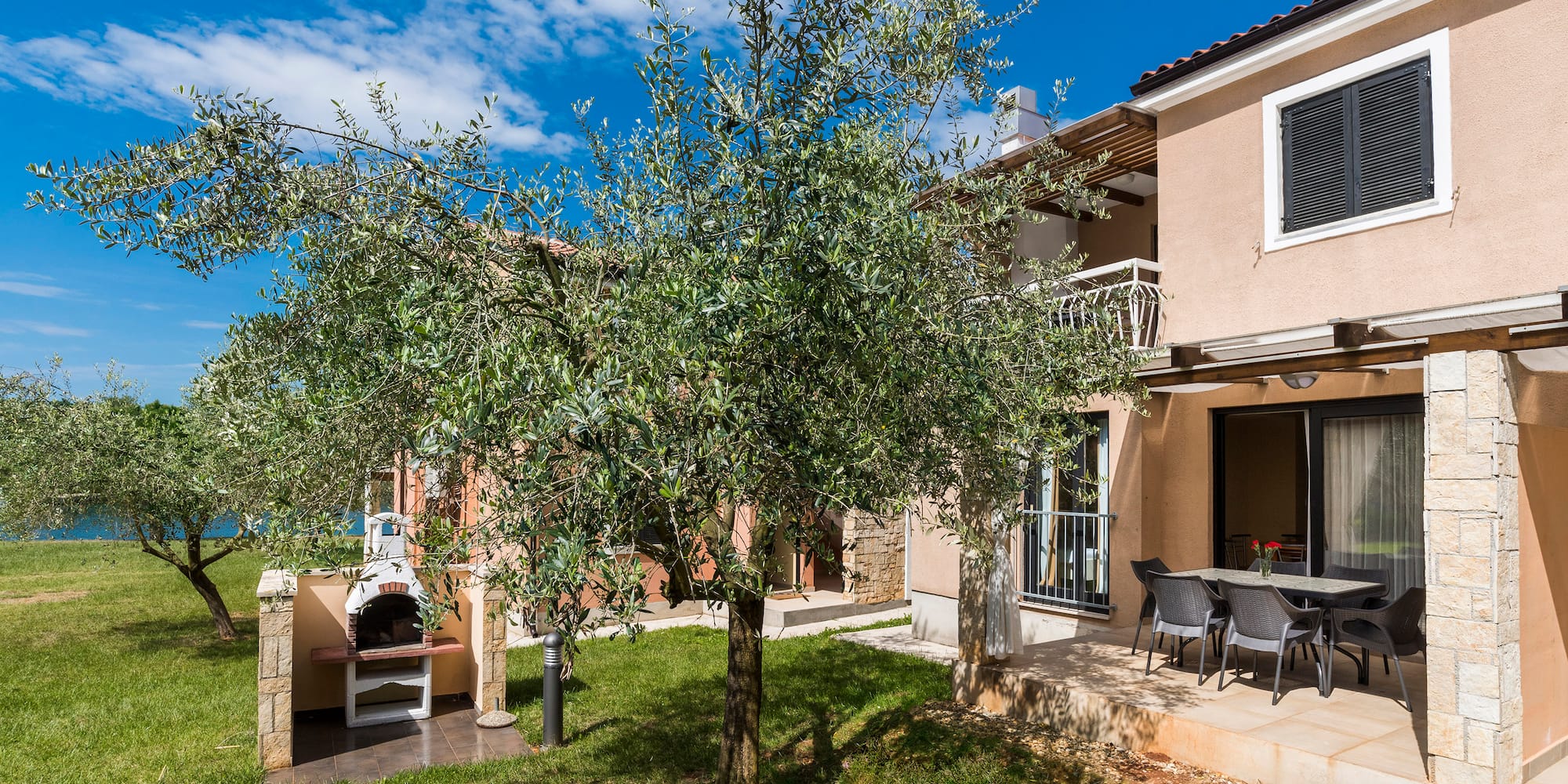 a tree in front of a house