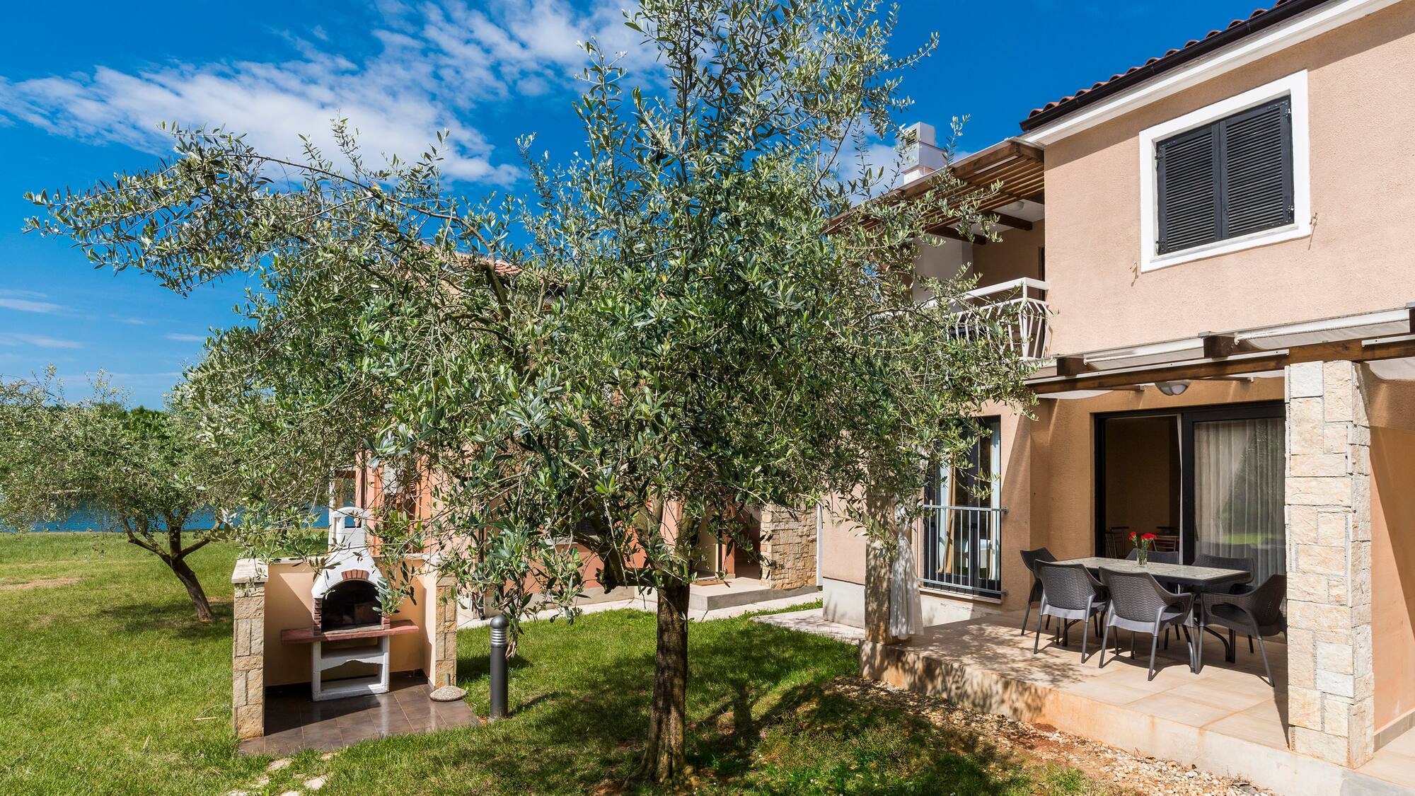 a tree in front of a house