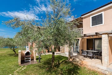 a tree in front of a house