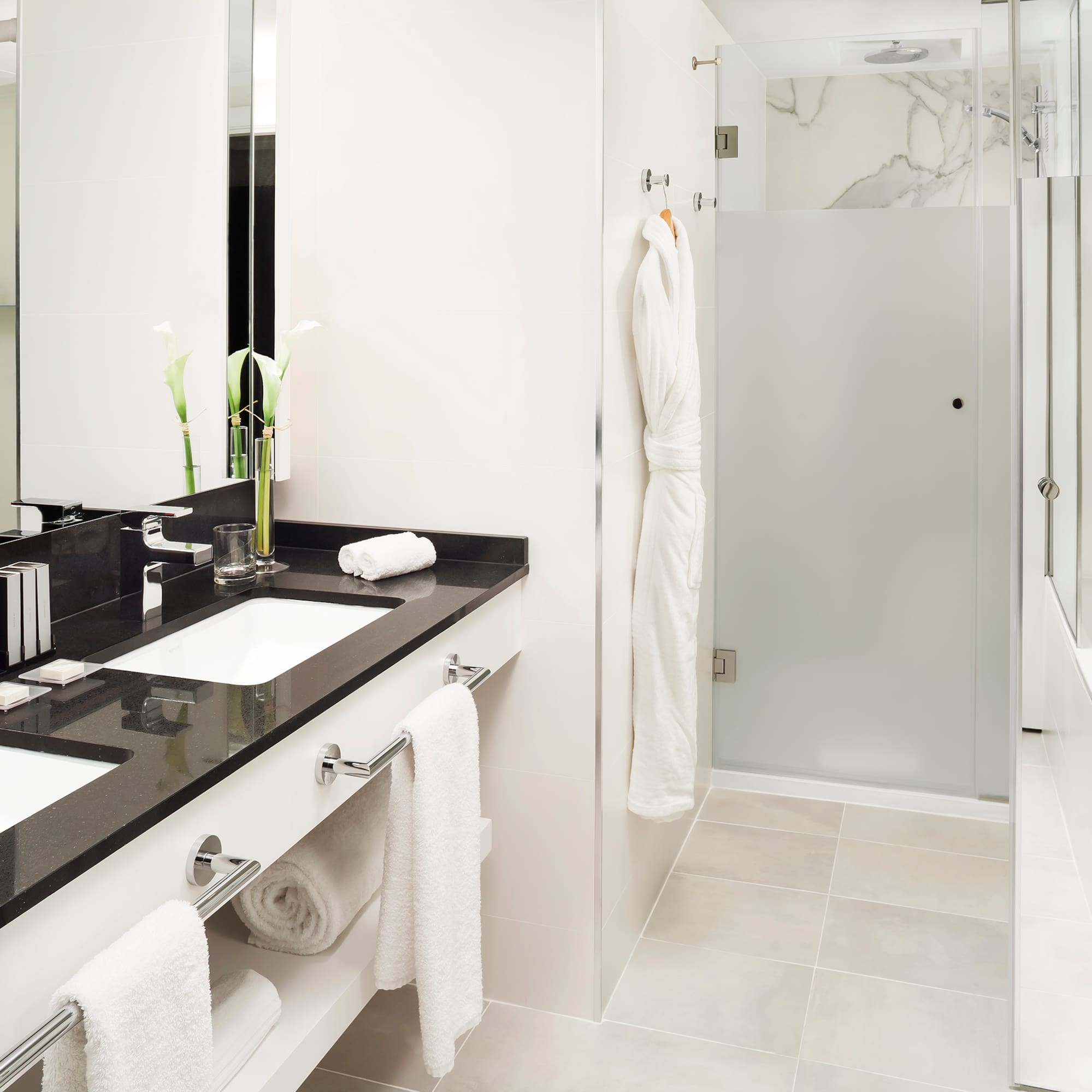 a bathroom with a shower and a sink