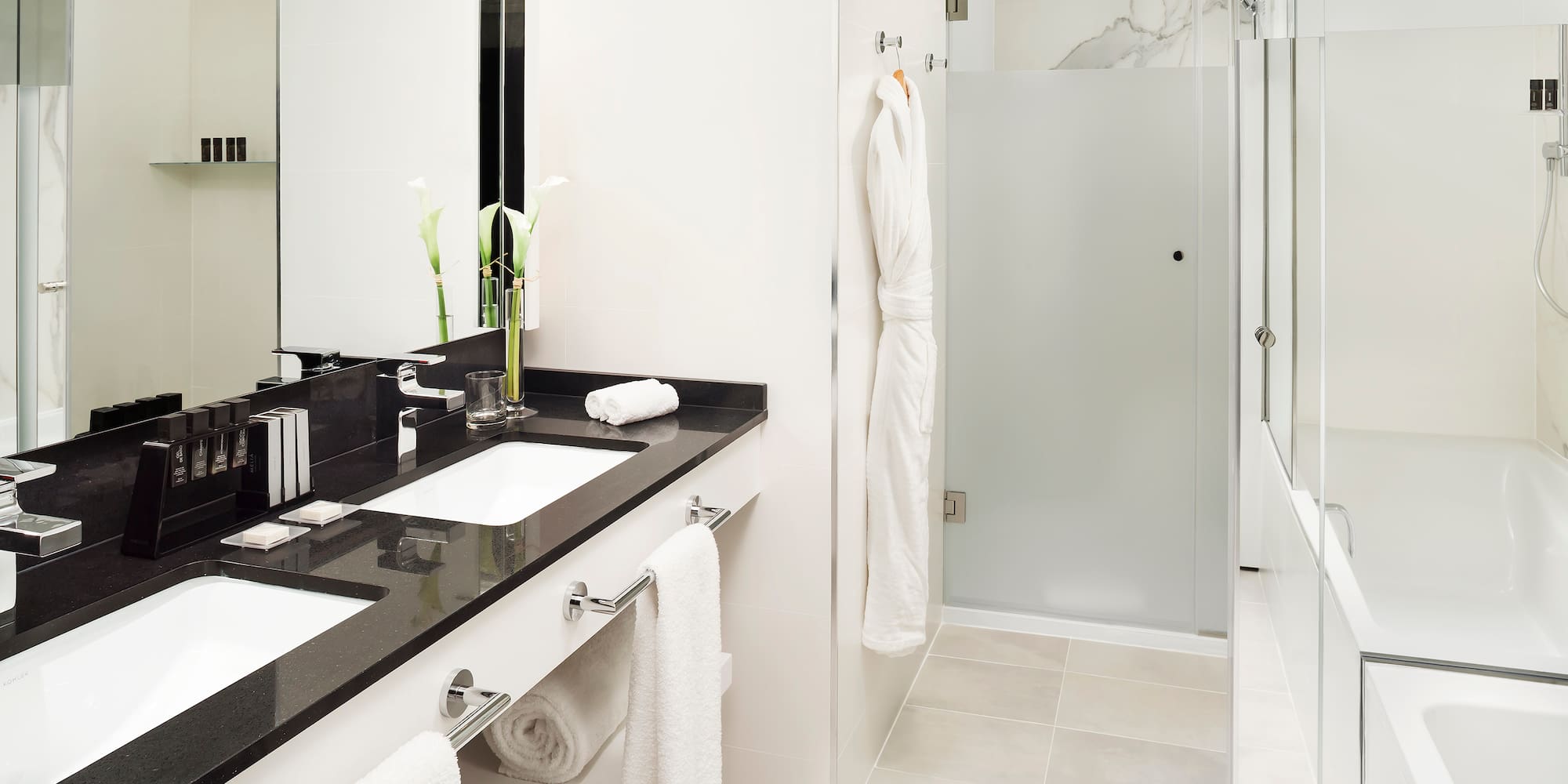 a bathroom with a shower and a sink