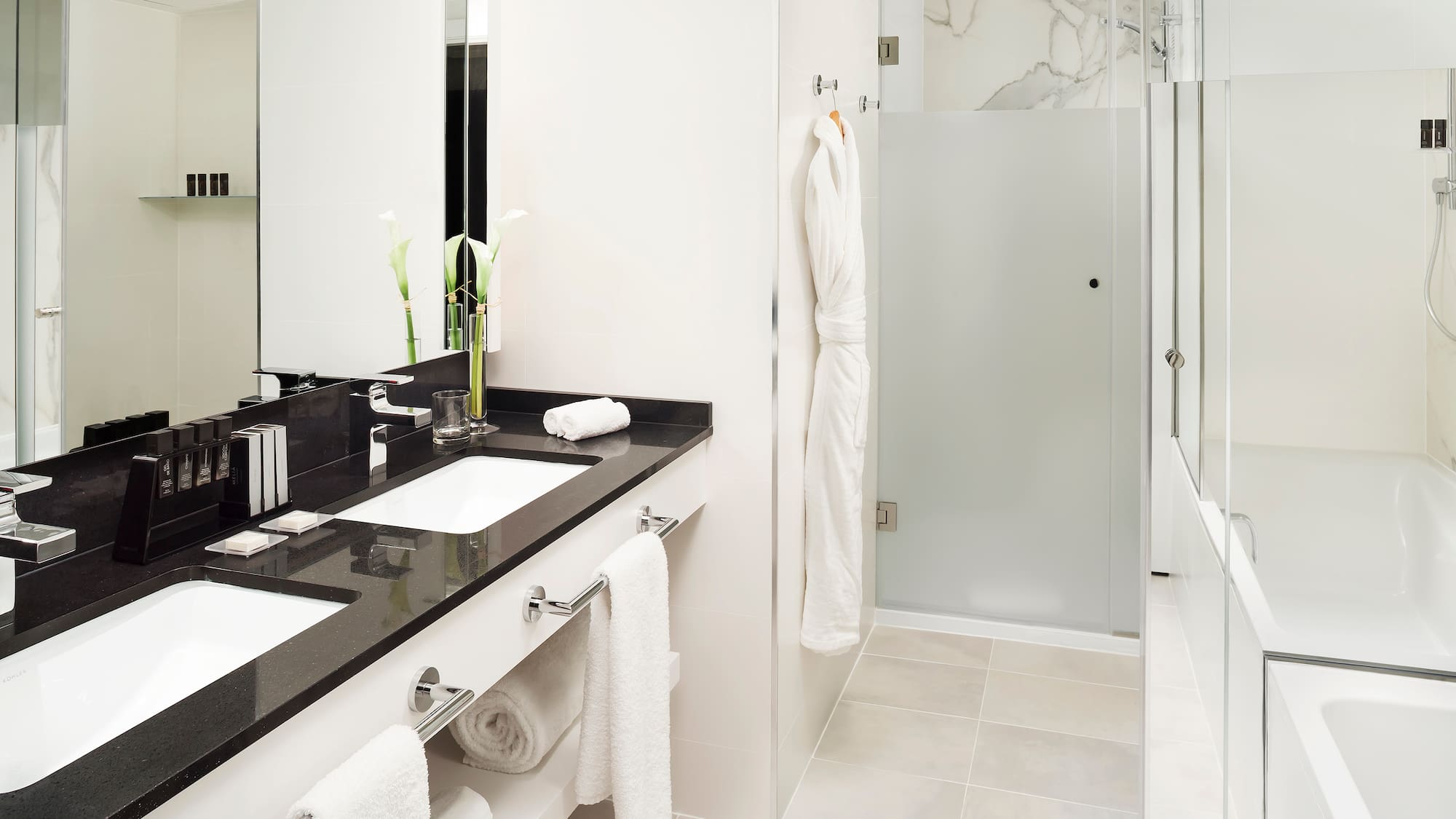 a bathroom with a shower and a sink