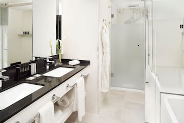 a bathroom with a shower and a sink