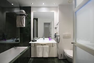 a bathroom with a sink and toilet