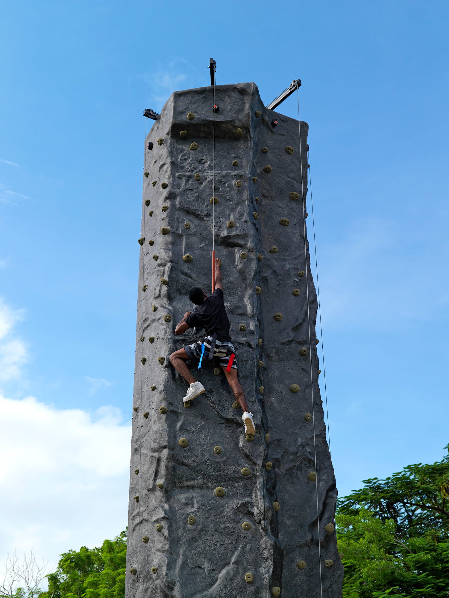 a person climbing a rock wall