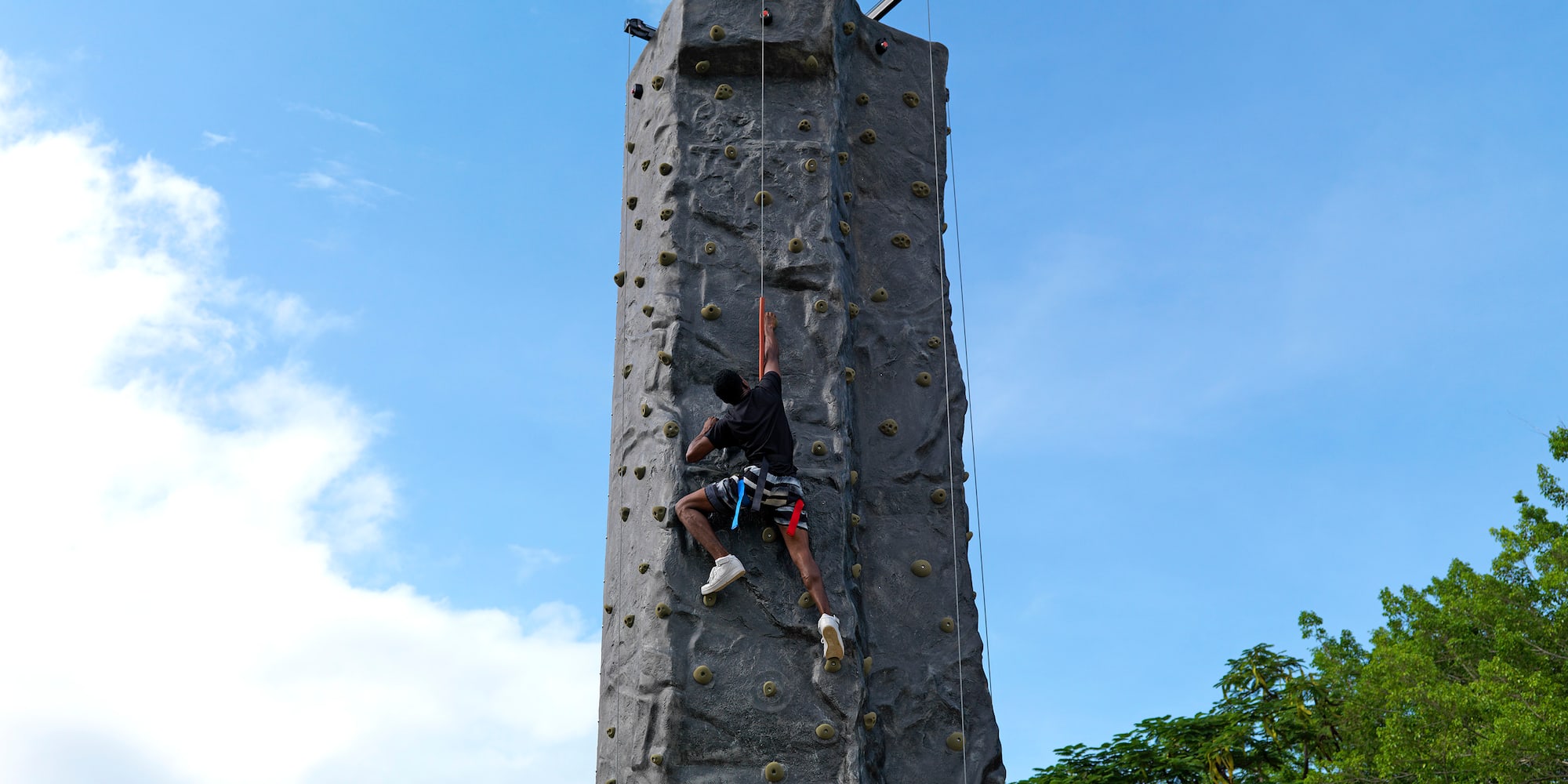 a person climbing a rock wall