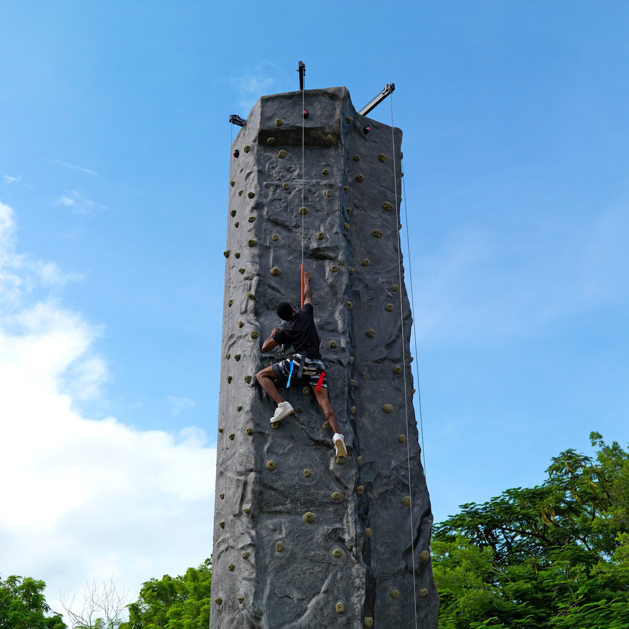a person climbing a rock wall