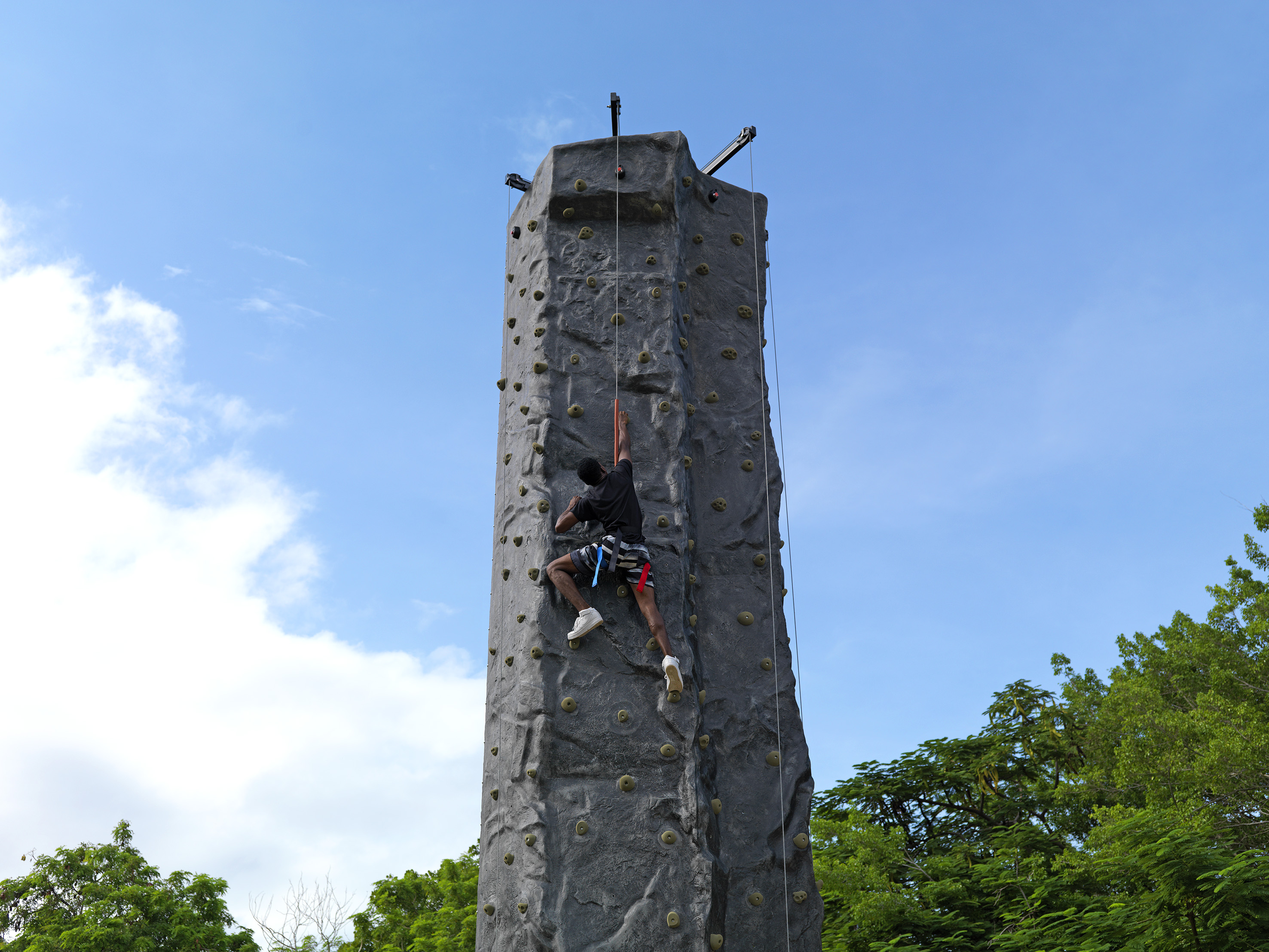 a person climbing a rock wall