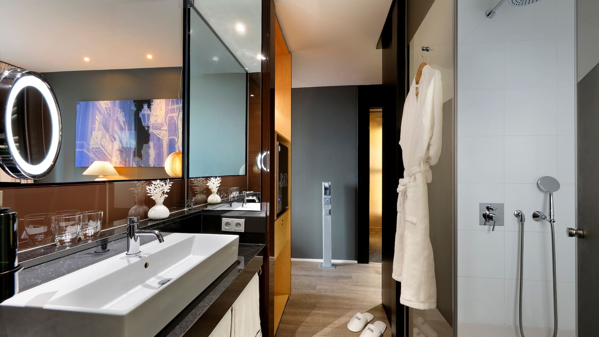 a bathroom with a white bathrobe and a mirror