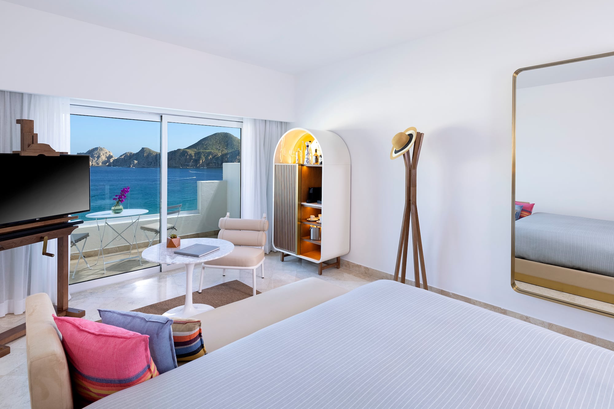 a room with a bed and a table and chair