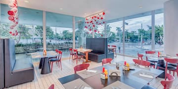 a restaurant with tables and chairs