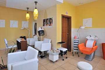 a room with chairs and a hair dryer