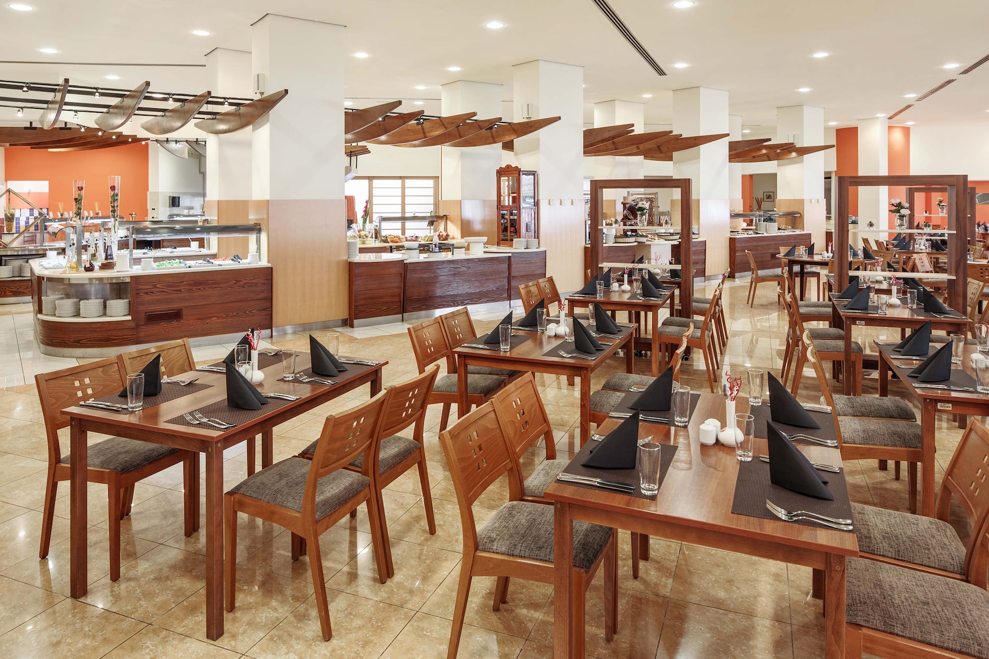 a restaurant with tables and chairs