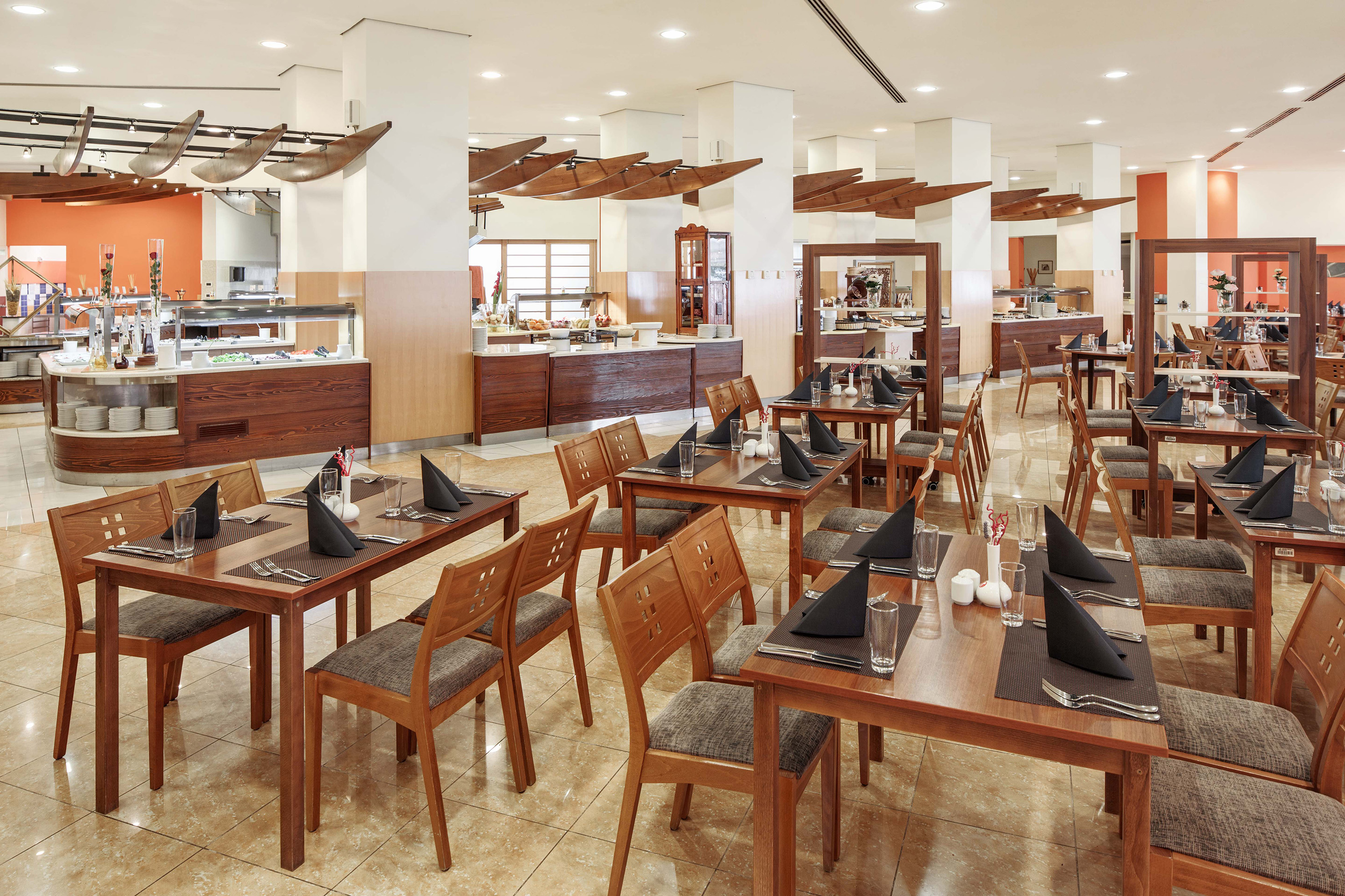 a restaurant with tables and chairs