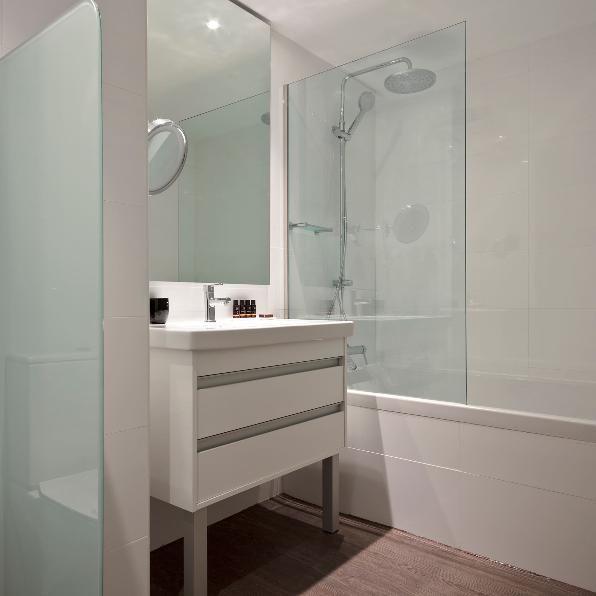 a bathroom with a shower and sink