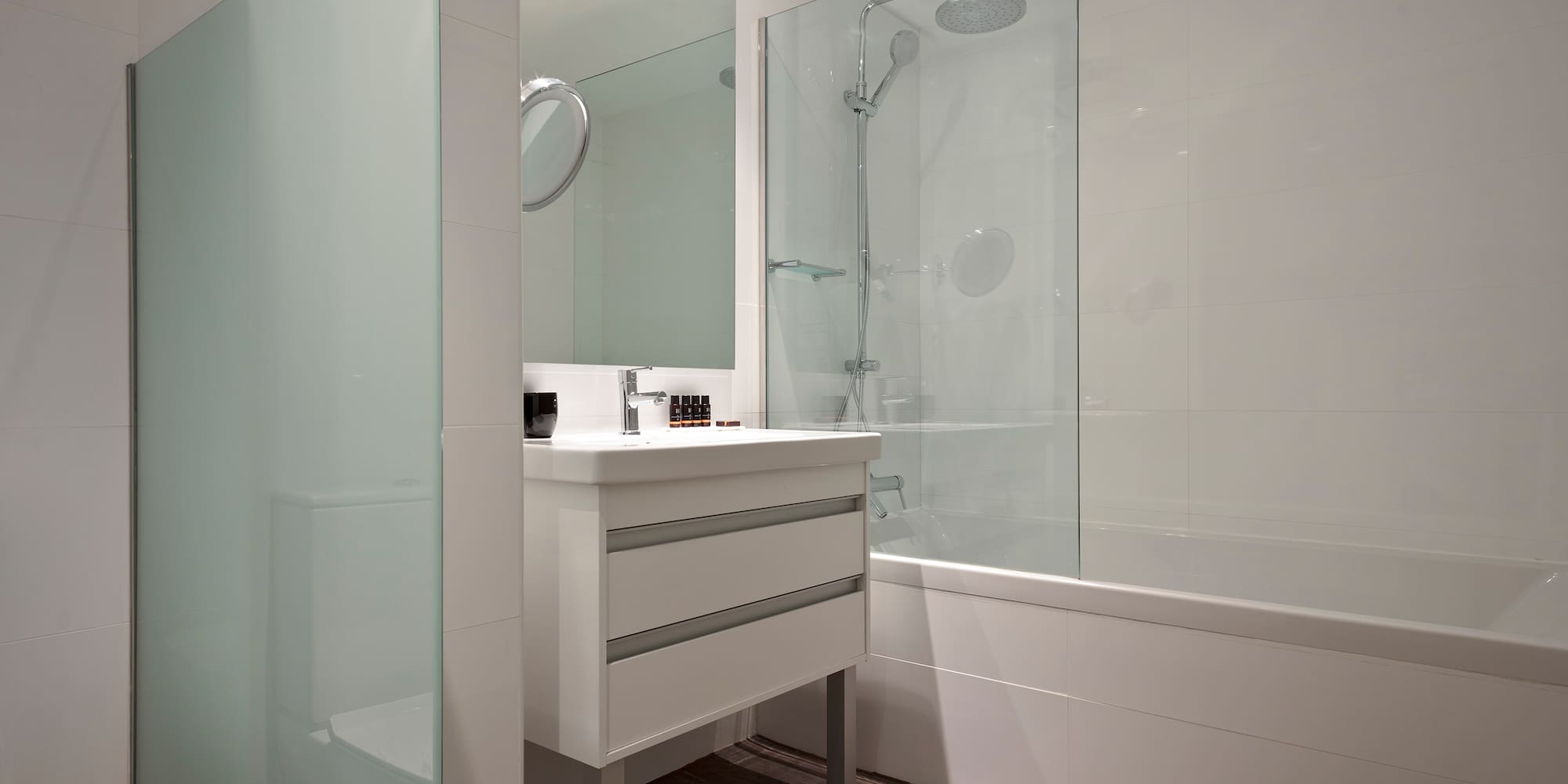 a bathroom with a shower and sink