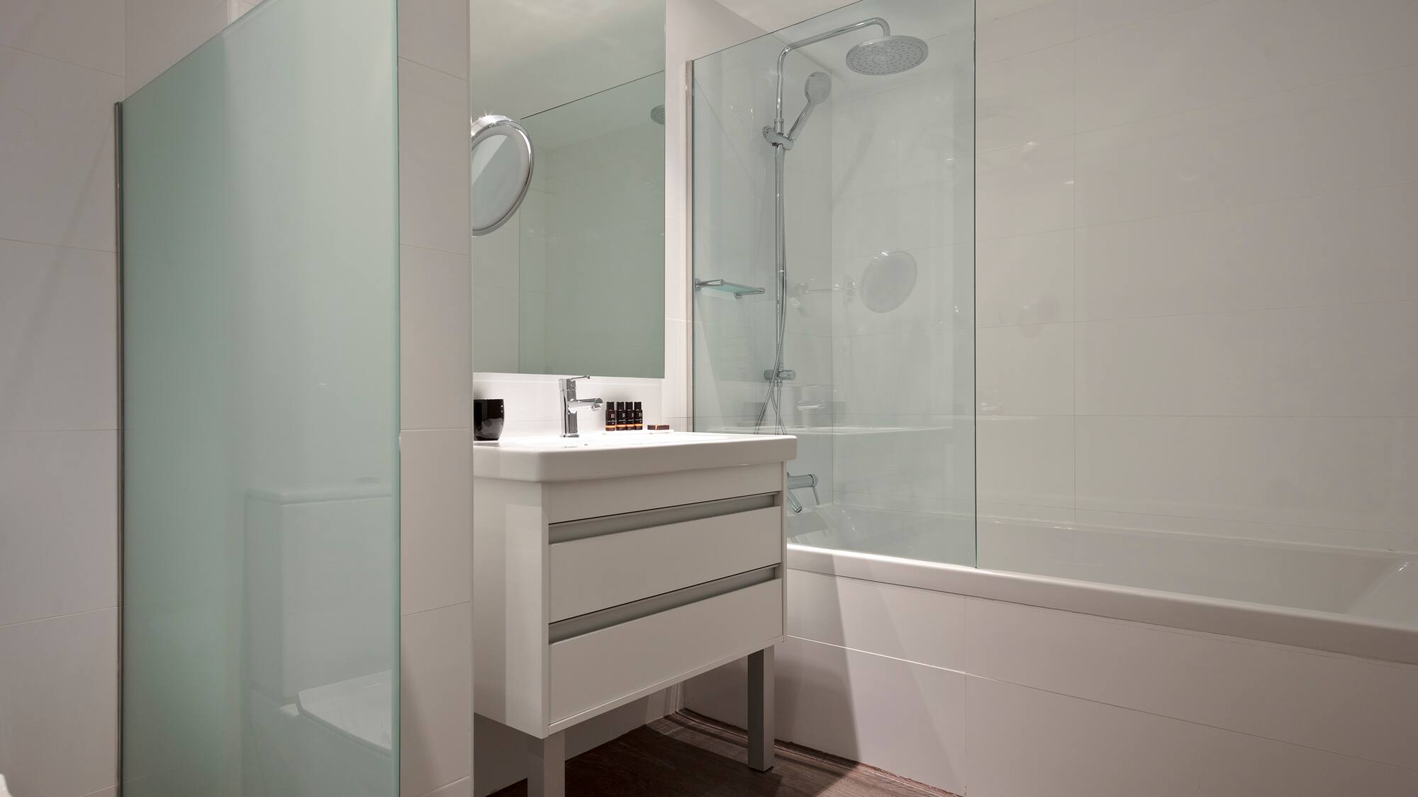 a bathroom with a shower and sink