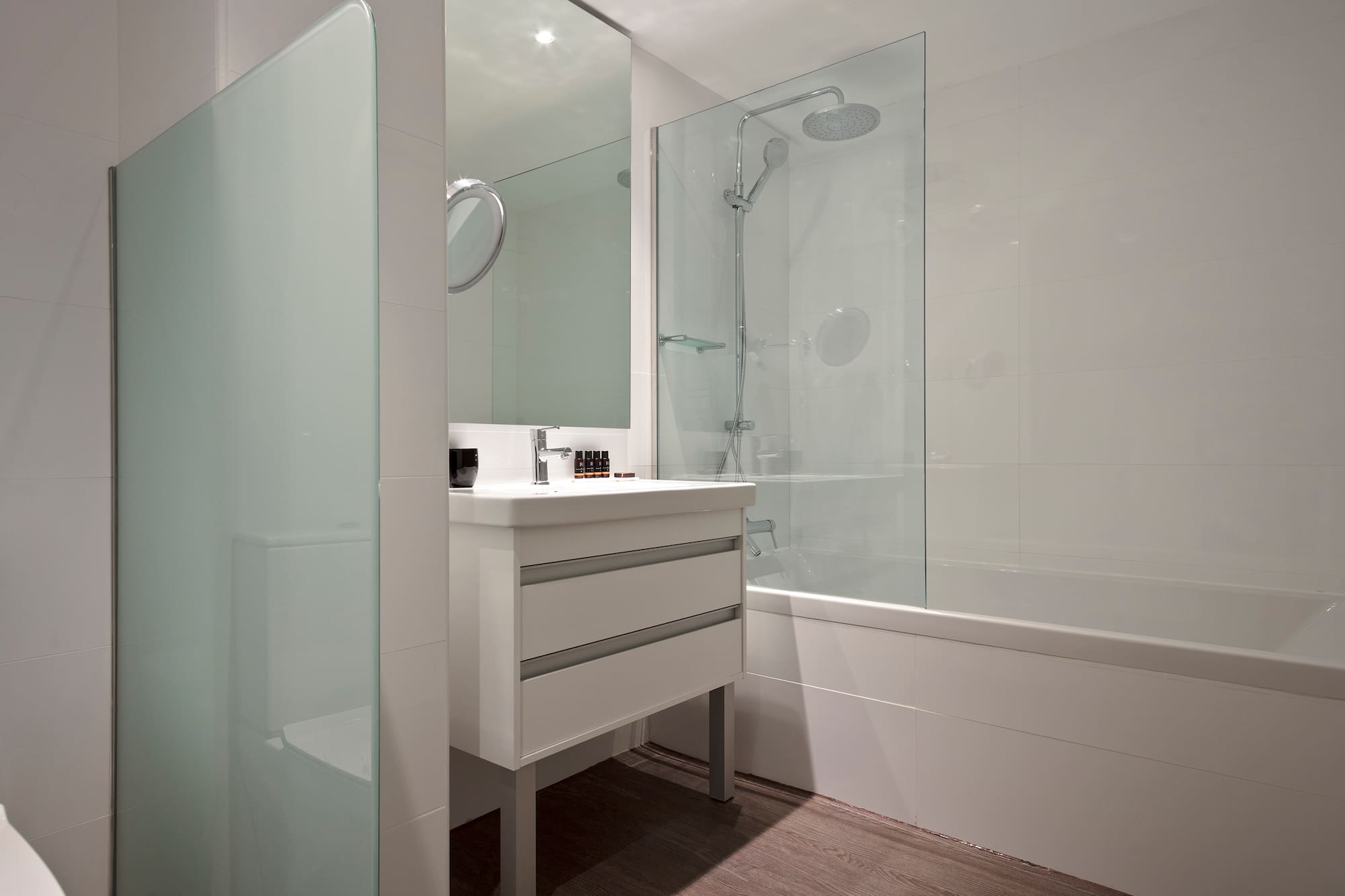 a bathroom with a shower and sink