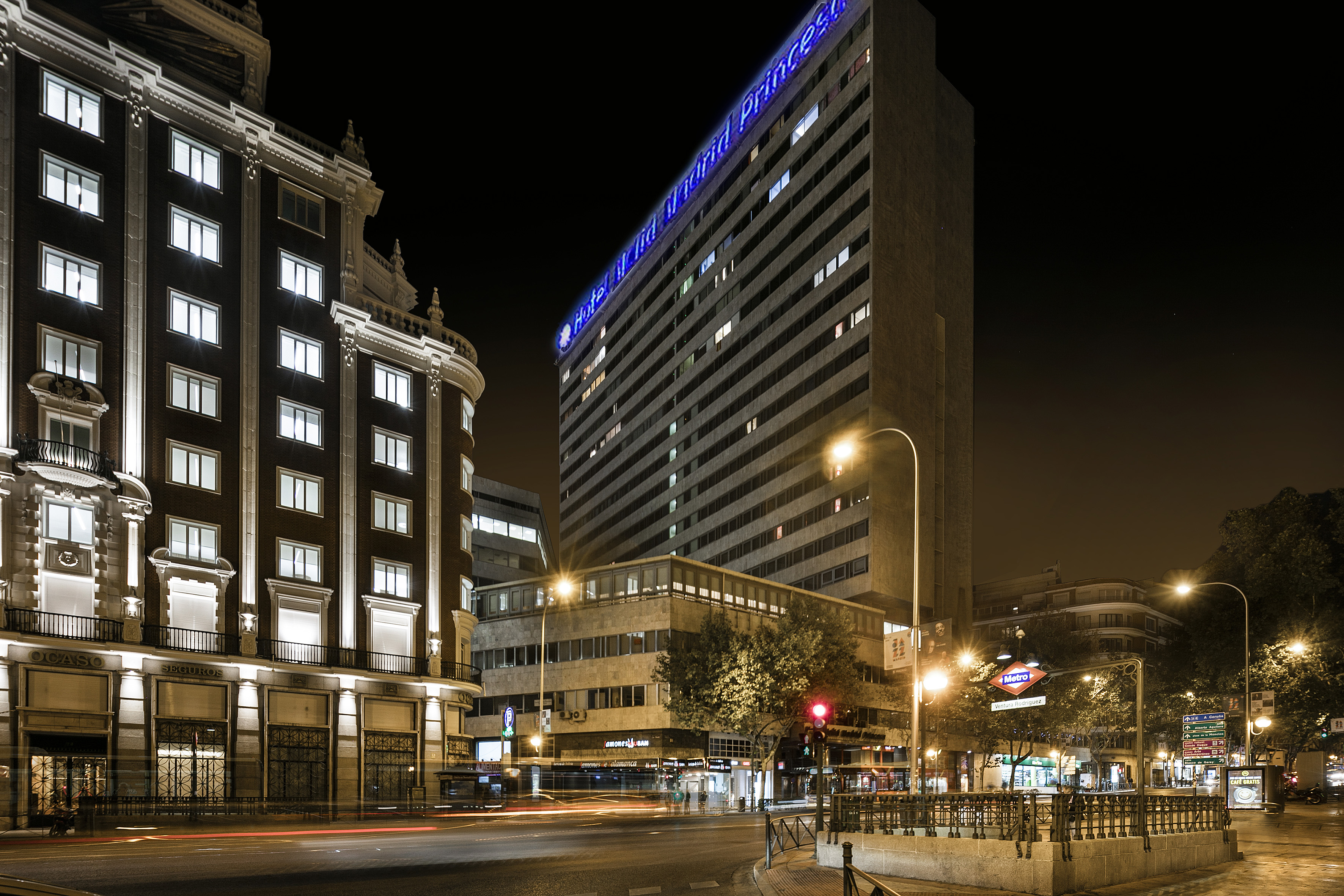 Hotel Madrid Princess, ornate architecture, Ventura Rodriguez Metro by night.