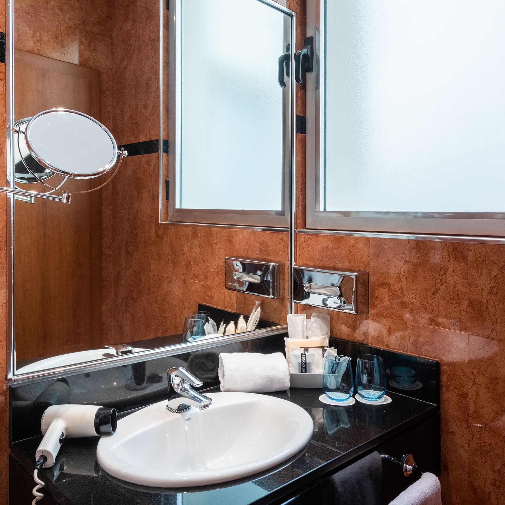 a bathroom with a sink and mirror