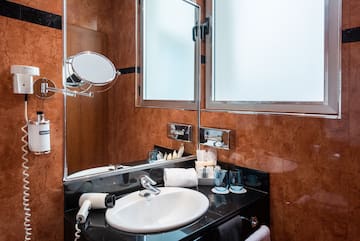 a bathroom with a sink and mirror