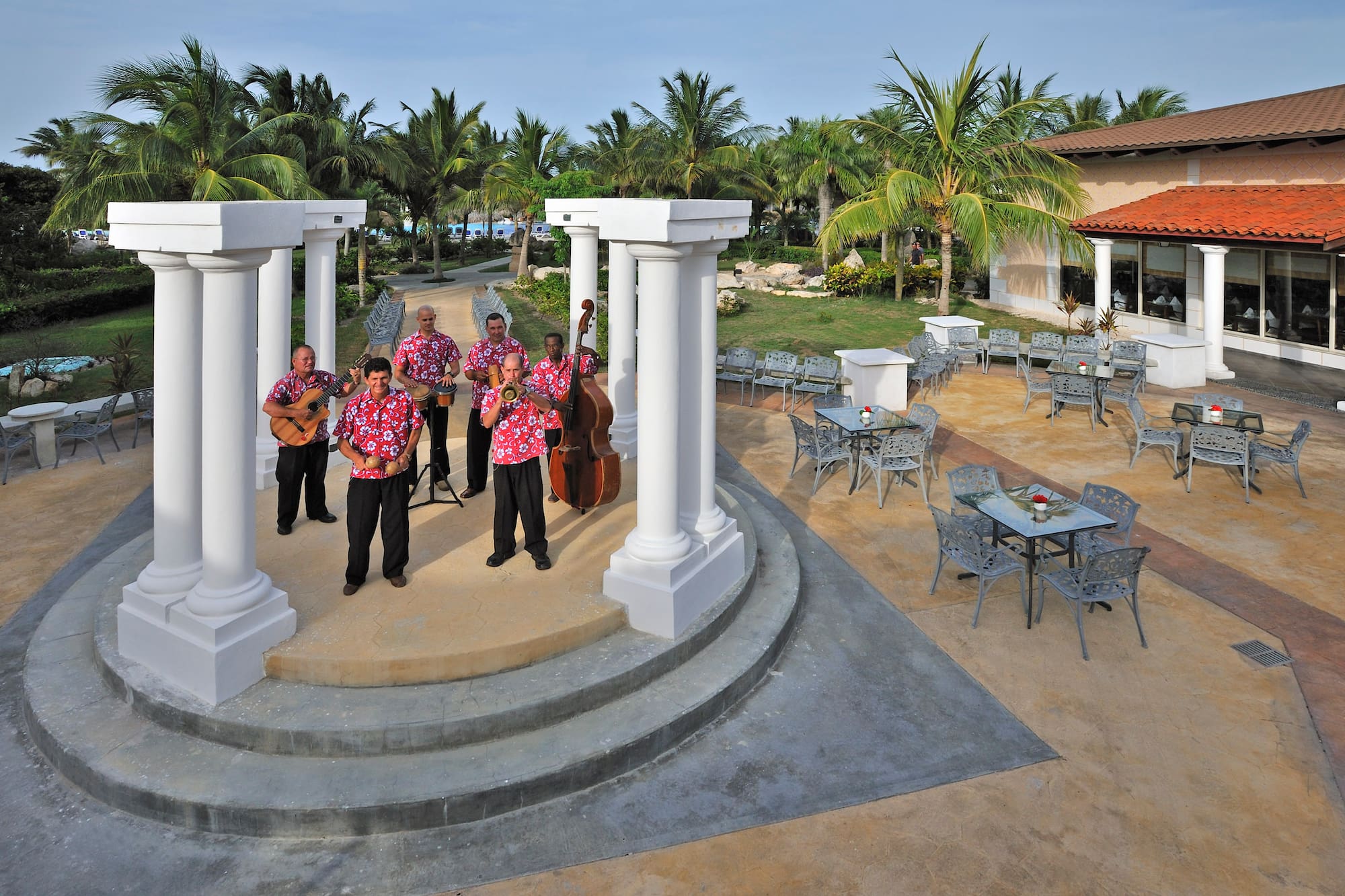 a group of men playing instruments on a stage