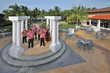 a group of men playing instruments on a stage