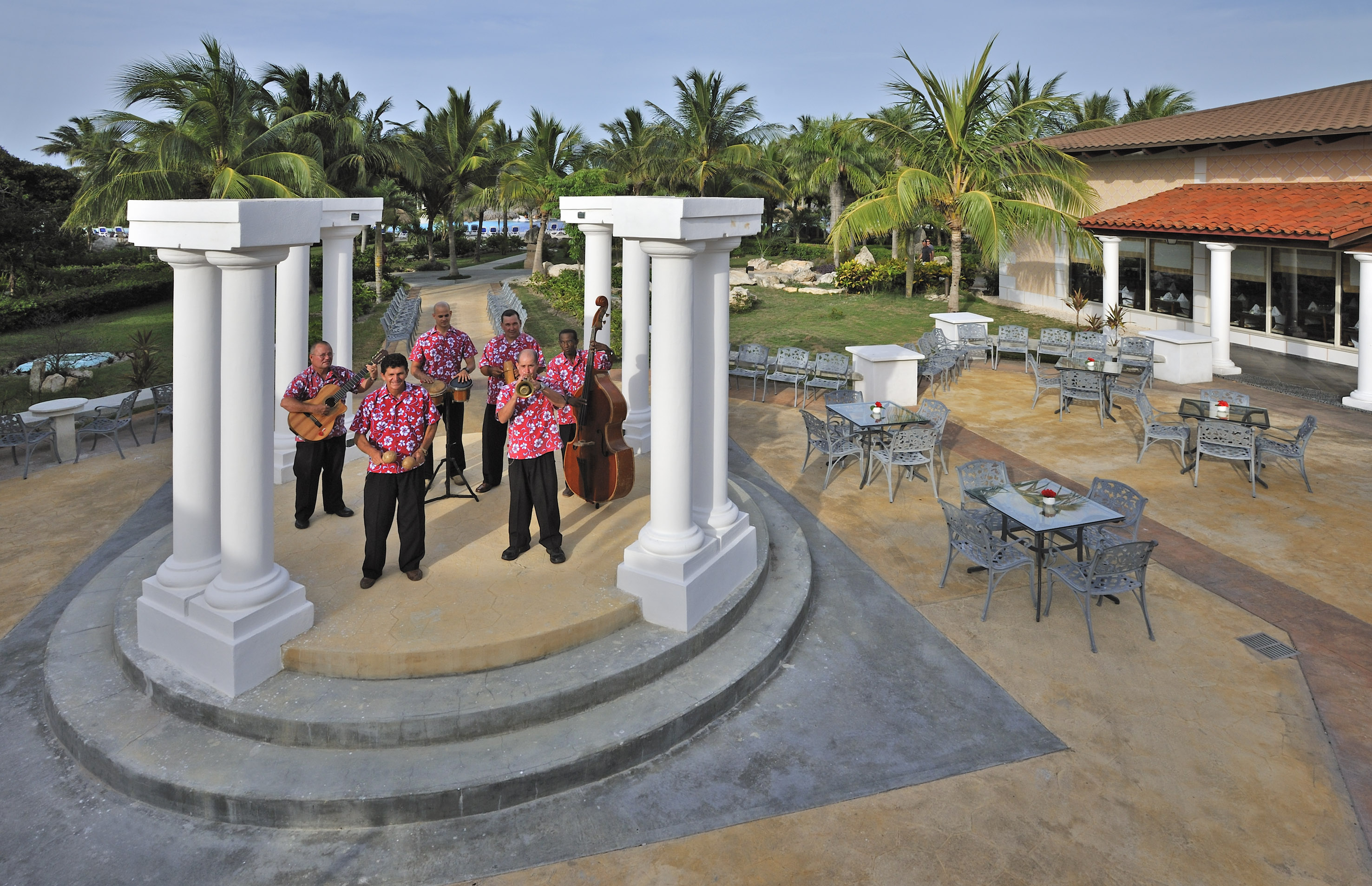 a group of men playing instruments on a stage