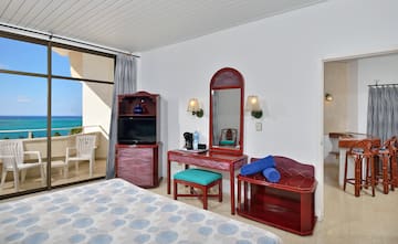 a bedroom with a mirror and a dresser