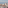 Madrid skyline with central dome, dense buildings, and snowy mountains.