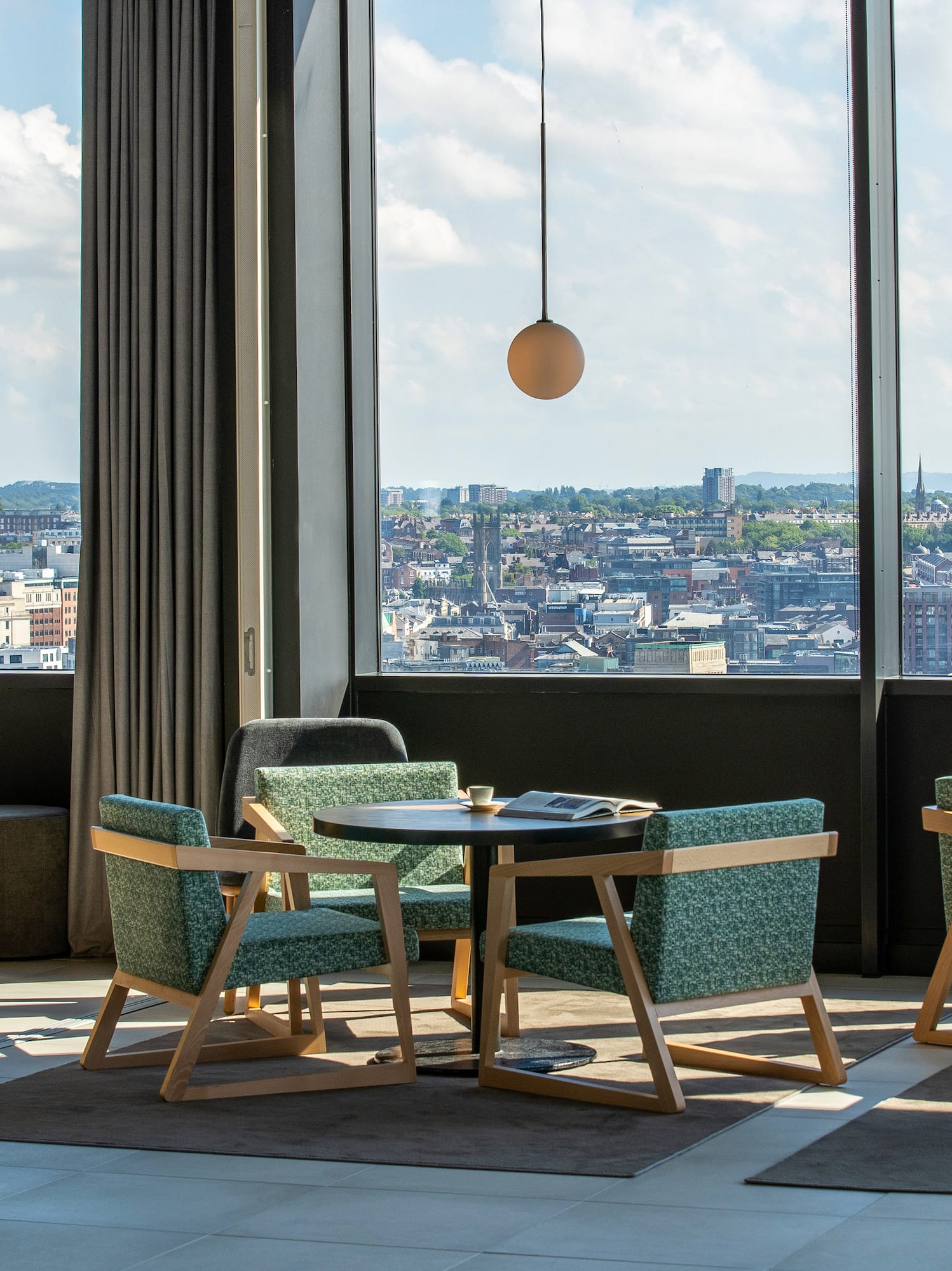 a room with a large window and a city view