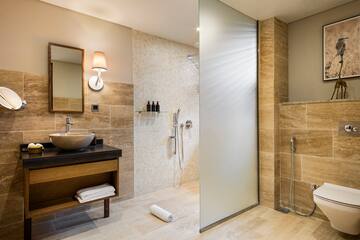 a bathroom with a shower and sink