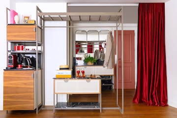 a room with a mirror and a dresser