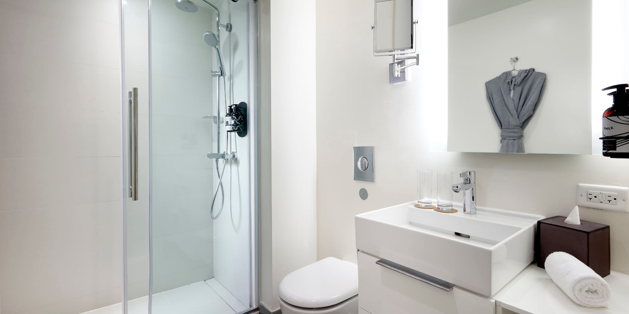 a bathroom with a shower and sink