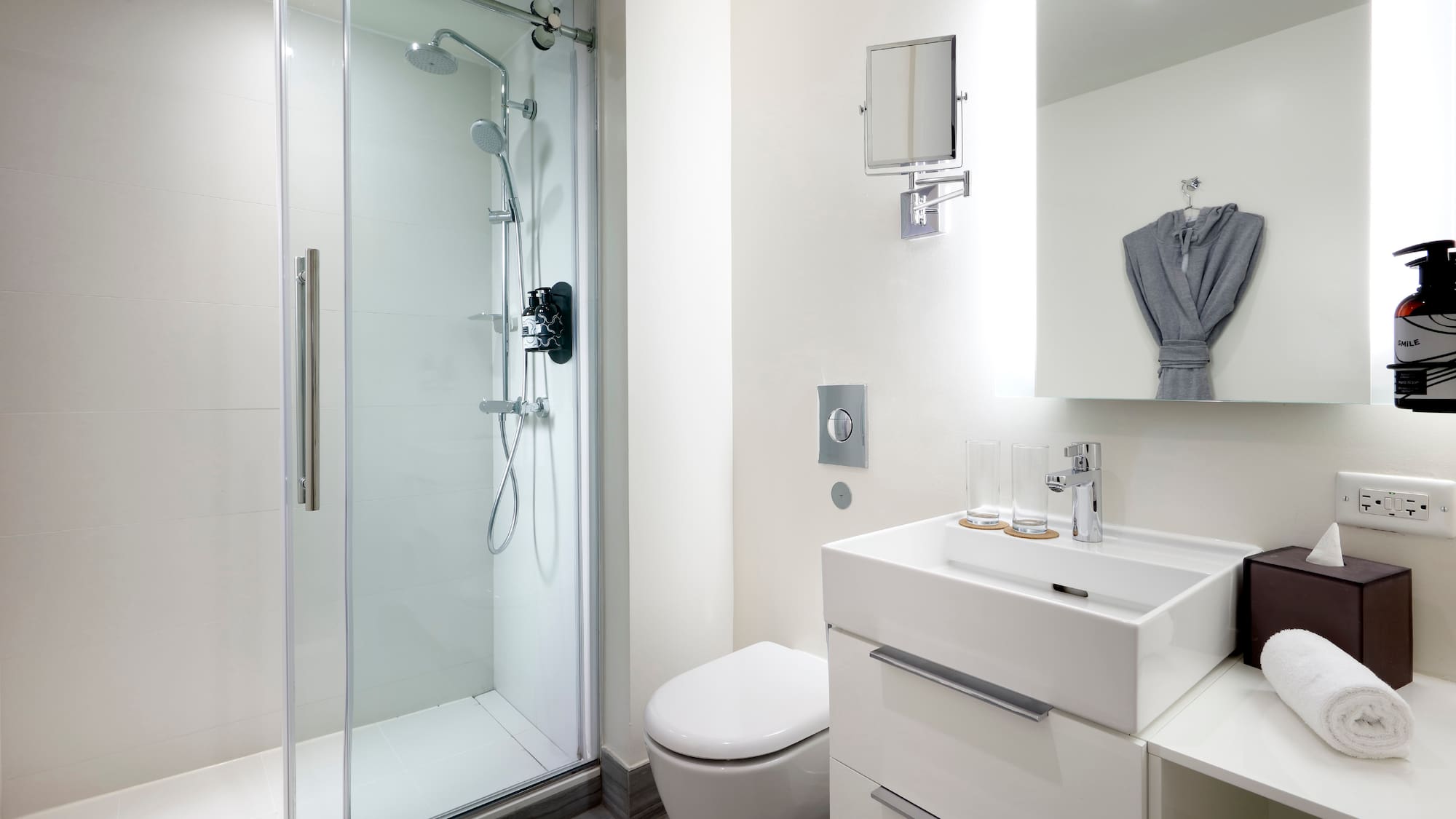 a bathroom with a shower and sink