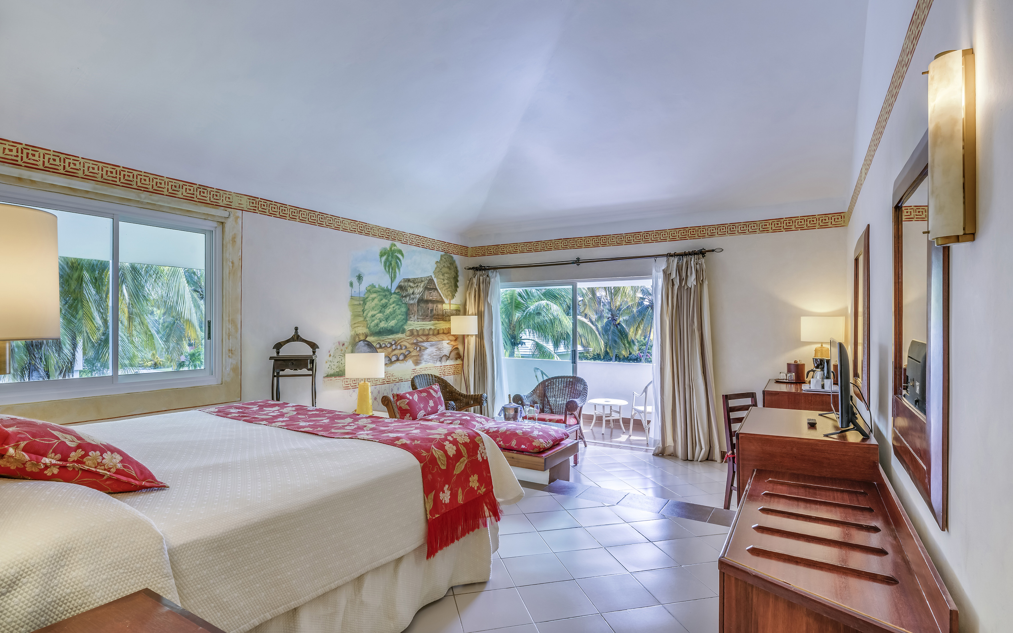 a bedroom with a bed and a desk